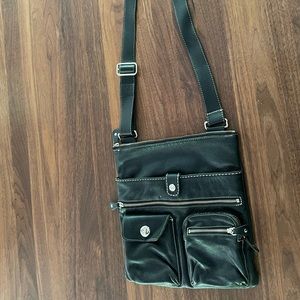 Leather bag with a lot if pockets. Very good condition.